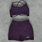 high-waisted, seamless, premium, activewear shorts, purple athleisure set. Purple sports bra and shorts set on a gray surface. 