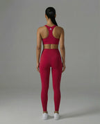 woman wearing Balance light leggings in with matching sports bra on a gray background